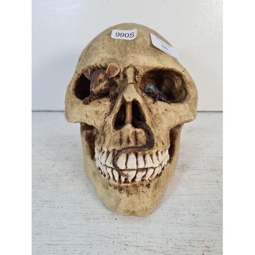 195 - A vintage resin model of a human skull - approx. 17cm high