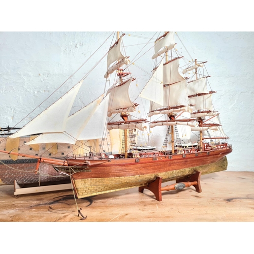 198 - Two scratch built wooden model ships on stands to include The Cutty Sark etc. - largest approx. 65cm... 