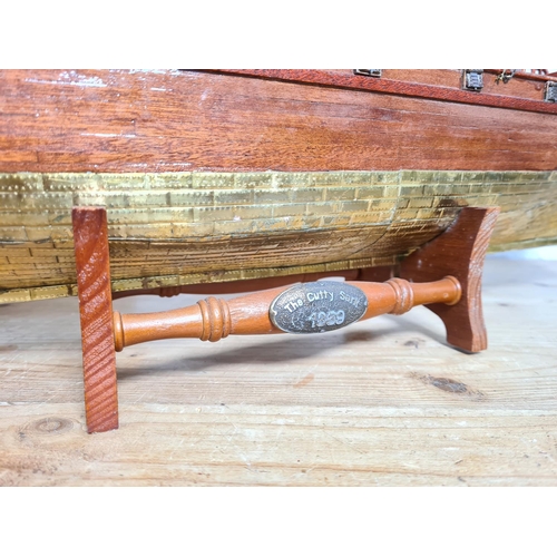 198 - Two scratch built wooden model ships on stands to include The Cutty Sark etc. - largest approx. 65cm... 