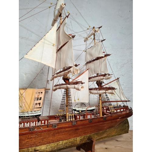 198 - Two scratch built wooden model ships on stands to include The Cutty Sark etc. - largest approx. 65cm... 