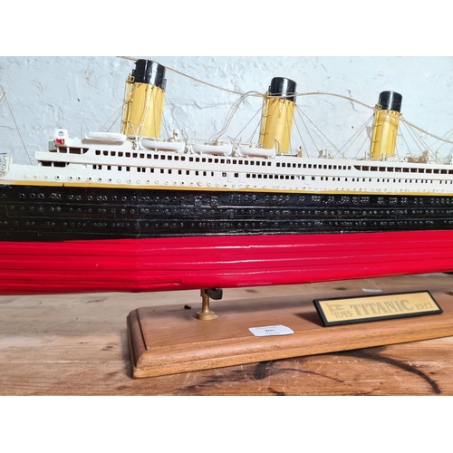 205 - A kit built and hand painted wooden model of The RMS Titanic on wooden plinth - approx. 34cm high x ... 