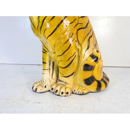 209 - A mid 20th century plaster tiger - approx. 50cm high