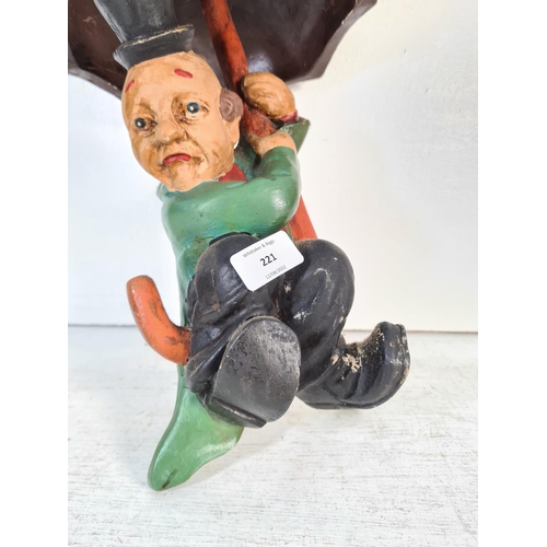 221 - A mid 20th century fibre glass clown figurine on umbrella - approx. 46cm high