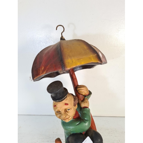 221 - A mid 20th century fibre glass clown figurine on umbrella - approx. 46cm high