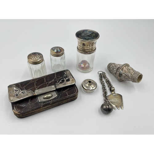 1228 - A collection of hallmarked silver and white metal items to include an Edward VII brown leather and h... 