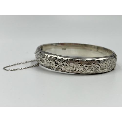 1229 - Six items of hallmarked Birmingham silver comprising hand mirror dated 1929, three napkin rings, one... 