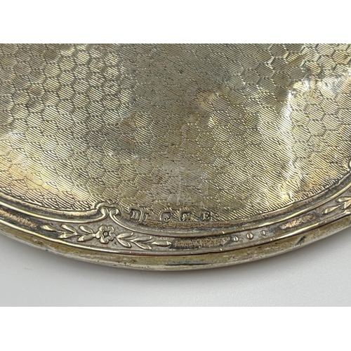 1229 - Six items of hallmarked Birmingham silver comprising hand mirror dated 1929, three napkin rings, one... 