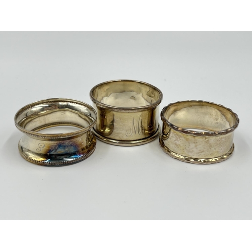 1229 - Six items of hallmarked Birmingham silver comprising hand mirror dated 1929, three napkin rings, one... 