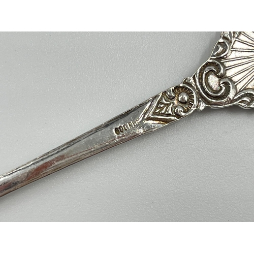 1230 - A selection of hallmarked silver to include three George III London teaspoons dated 1816, George V T... 