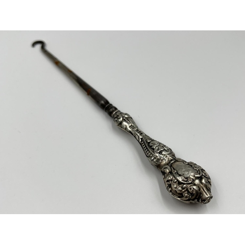 1239 - Five items of hallmarked silver comprising Birmingham hairbrush dated 1961, Birmingham hand mirror d... 