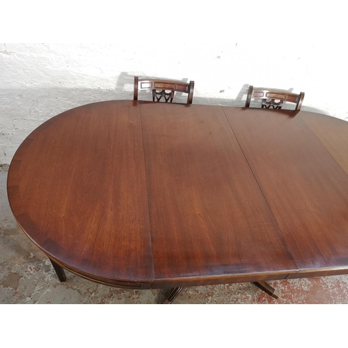 232 - A Bevan Funnell Reprodux mahogany extending pedestal dining table and six matching chairs - approx. ... 