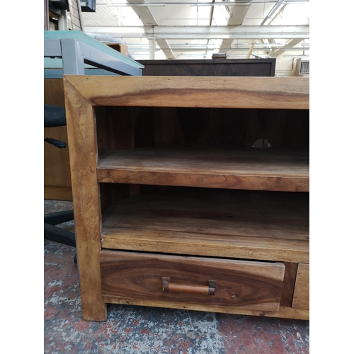 233 - An Indian sheesham wood TV stand with two lower drawers - approx. 60cm high x 100cm wide x 45cm deep