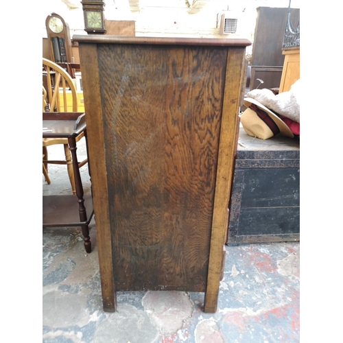 250 - A 1930s oak chest of five drawers - approx. 92cm high x 61cm wide x 44cm deep