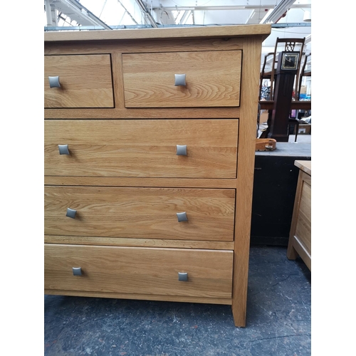 259 - A modern solid oak chest of two short over three long drawers - approx. 97cm high x 84cm wide x 43cm... 