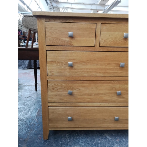 259 - A modern solid oak chest of two short over three long drawers - approx. 97cm high x 84cm wide x 43cm... 