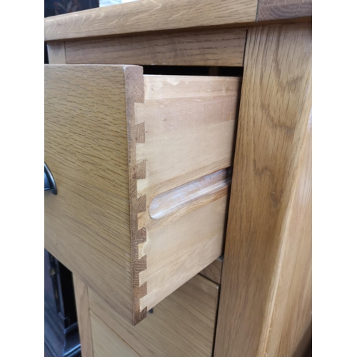 282 - A modern solid oak narrow chest of five drawers - approx. 128cm high x 45cm wide x 45cm deep