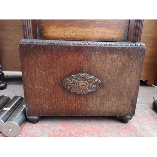 284 - A 1930s oak cased grandfather clock with bevelled glass door, pendulum and three weights - approx. 1... 