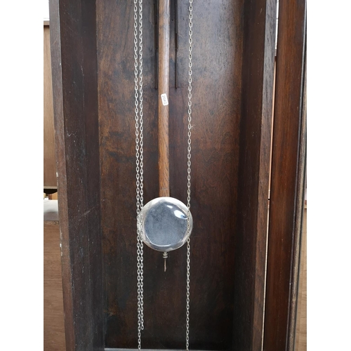 284 - A 1930s oak cased grandfather clock with bevelled glass door, pendulum and three weights - approx. 1... 