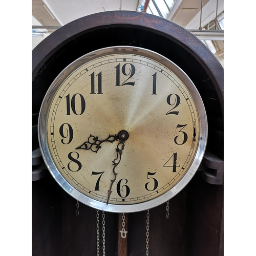 284 - A 1930s oak cased grandfather clock with bevelled glass door, pendulum and three weights - approx. 1... 