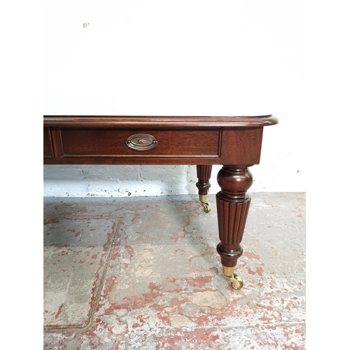 337A - A Regency style mahogany rectangular coffee table with three drawers and brass castors - approx. 48c... 