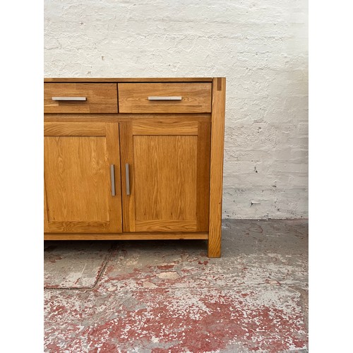 262A - An Arighi Bianchi solid oak sideboard with three drawers and three lower cupboard doors - approx. 86... 