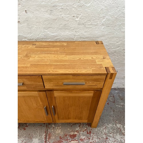 262A - An Arighi Bianchi solid oak sideboard with three drawers and three lower cupboard doors - approx. 86... 