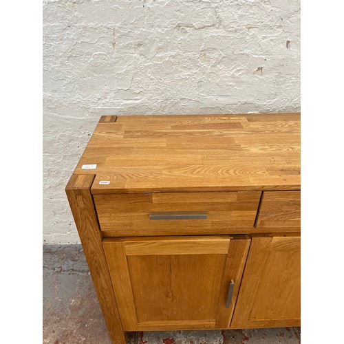 262A - An Arighi Bianchi solid oak sideboard with three drawers and three lower cupboard doors - approx. 86... 