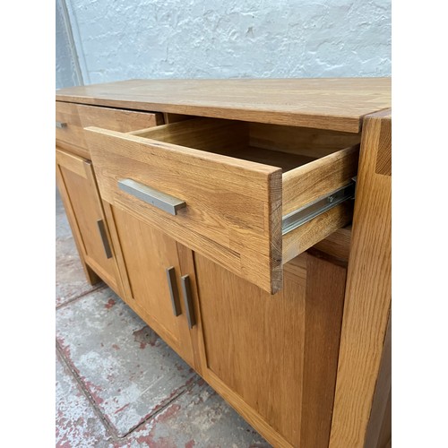 262A - An Arighi Bianchi solid oak sideboard with three drawers and three lower cupboard doors - approx. 86... 