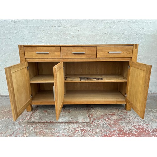 262A - An Arighi Bianchi solid oak sideboard with three drawers and three lower cupboard doors - approx. 86... 