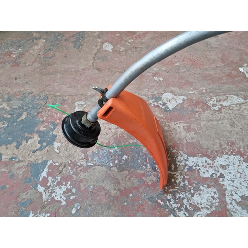 550 - A Husqvarna 322C petrol powered strimmer