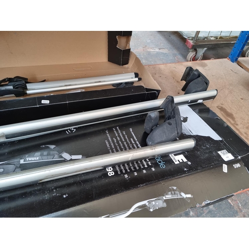 552 - Three items comprising two boxed pairs of Thule ProRide upright bike carriers and one pair of car ro... 