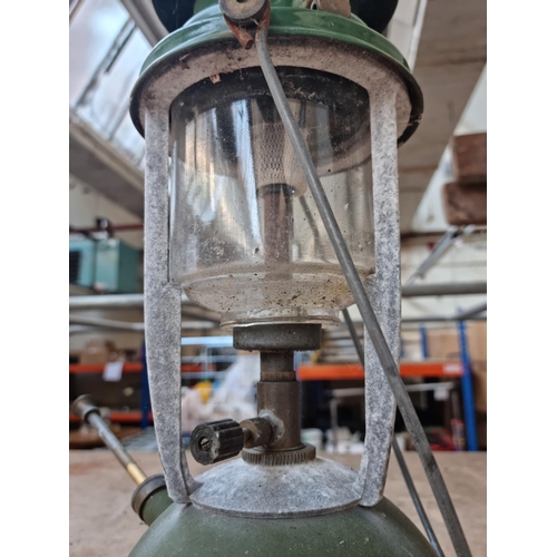 553 - A vintage cast metal and enamel paraffin lantern