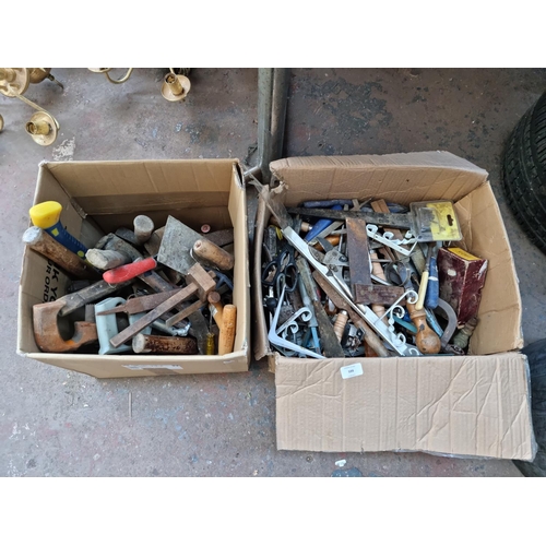 599 - Two boxes containing a large quantity of assorted hand tools to include Blue Spot Pro Series axe, fi... 