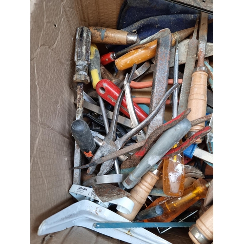 599 - Two boxes containing a large quantity of assorted hand tools to include Blue Spot Pro Series axe, fi... 