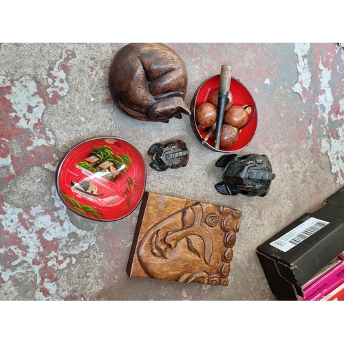 604 - A box and a bag containing assorted Oriental items to include carved hardwood Buddha wall plaque, ca... 