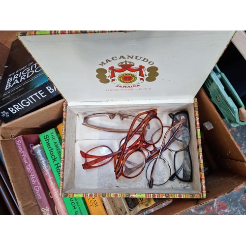 607 - Two boxes containing assorted house clearance items to include framed prints, books, Royal Doulton J... 