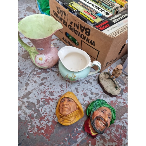 608 - Two boxes containing assorted house clearance items to include two Bossons hand painted chalkware he... 