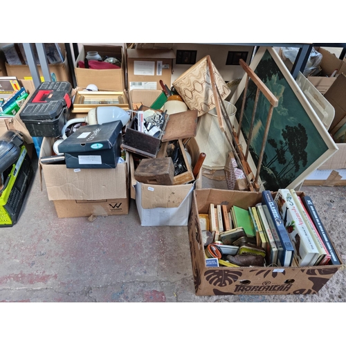 610 - Five boxes containing a large quantity of house clearance items to include books, kitchenware, Nokia... 