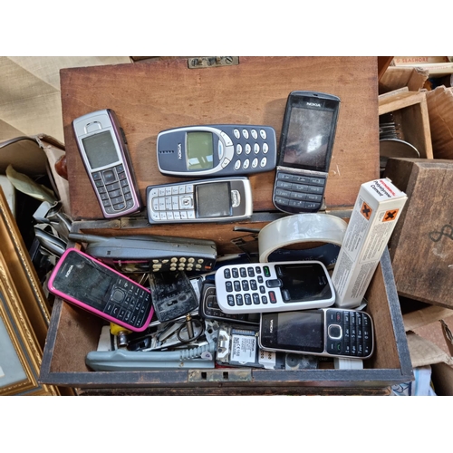 610 - Five boxes containing a large quantity of house clearance items to include books, kitchenware, Nokia... 