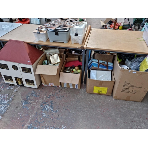 615 - Four boxes containing assorted house clearance items to include hand painted wooden dolls house - ap... 