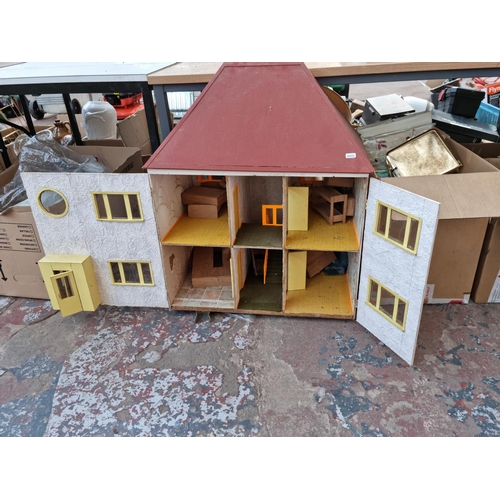 615 - Four boxes containing assorted house clearance items to include hand painted wooden dolls house - ap... 