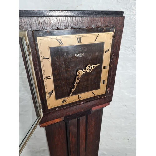 243 - A 1930s Smith Electric oak cased granddaughter clock with later added quartz movement - approx. 137c... 