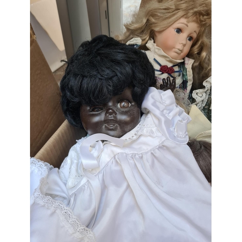 650 - Three boxes containing a large collection of vintage dolls to include Ashton Drake Cute as a Button ... 