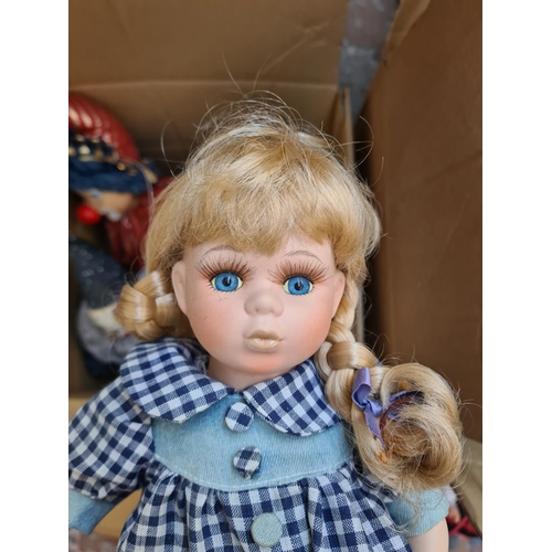 650 - Three boxes containing a large collection of vintage dolls to include Ashton Drake Cute as a Button ... 