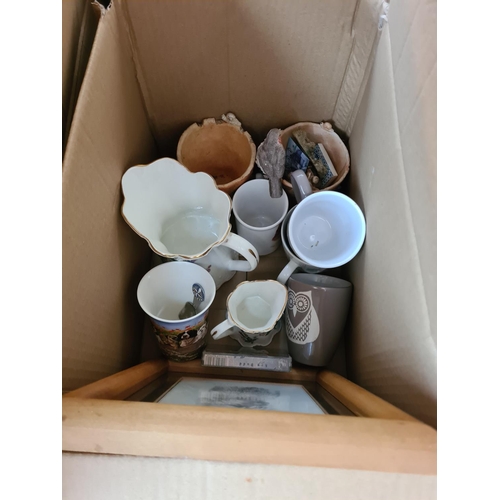 654 - Twelve boxes containing assorted items to include brassware, treenware, Beswick animal figurines, cu... 