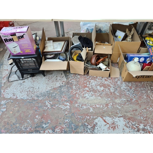 654 - Twelve boxes containing assorted items to include brassware, treenware, Beswick animal figurines, cu... 