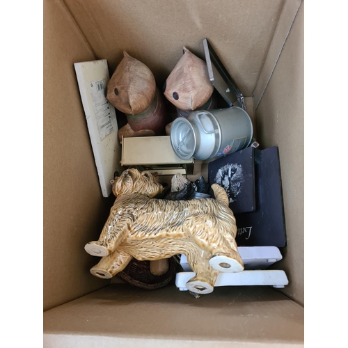 654 - Twelve boxes containing assorted items to include brassware, treenware, Beswick animal figurines, cu... 