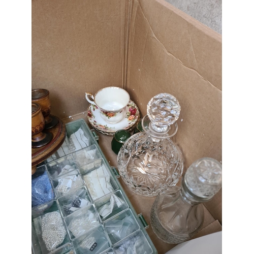 656 - Two boxes containing assorted items to include boxed pair of Royal Doulton finest crystal champagne ... 