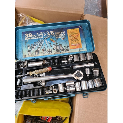 657 - A box containing assorted items to include cased socket set, nails, screws, model railway accessorie... 