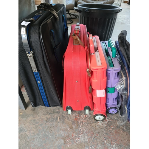 658 - A large collection of assorted travel cases and camping chairs